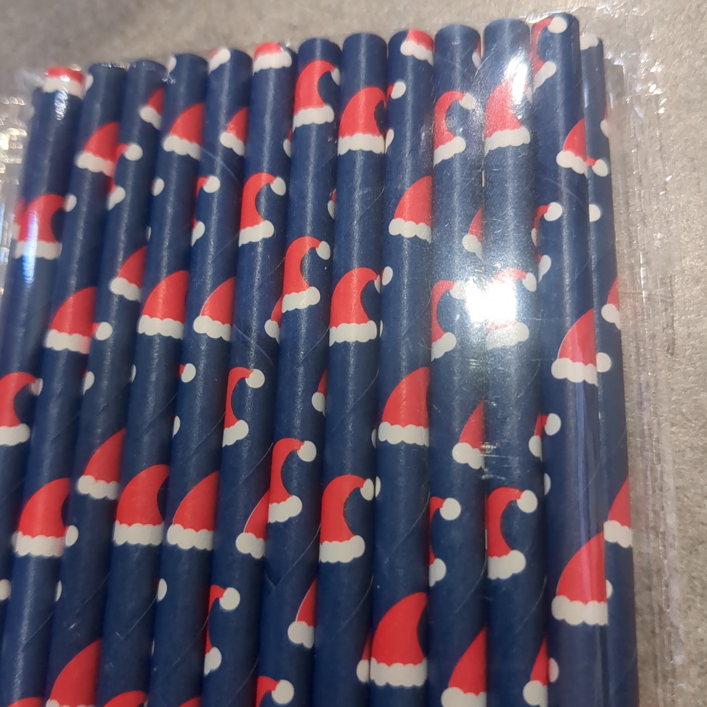 25 navy blue paper drinking straws with Santa hats