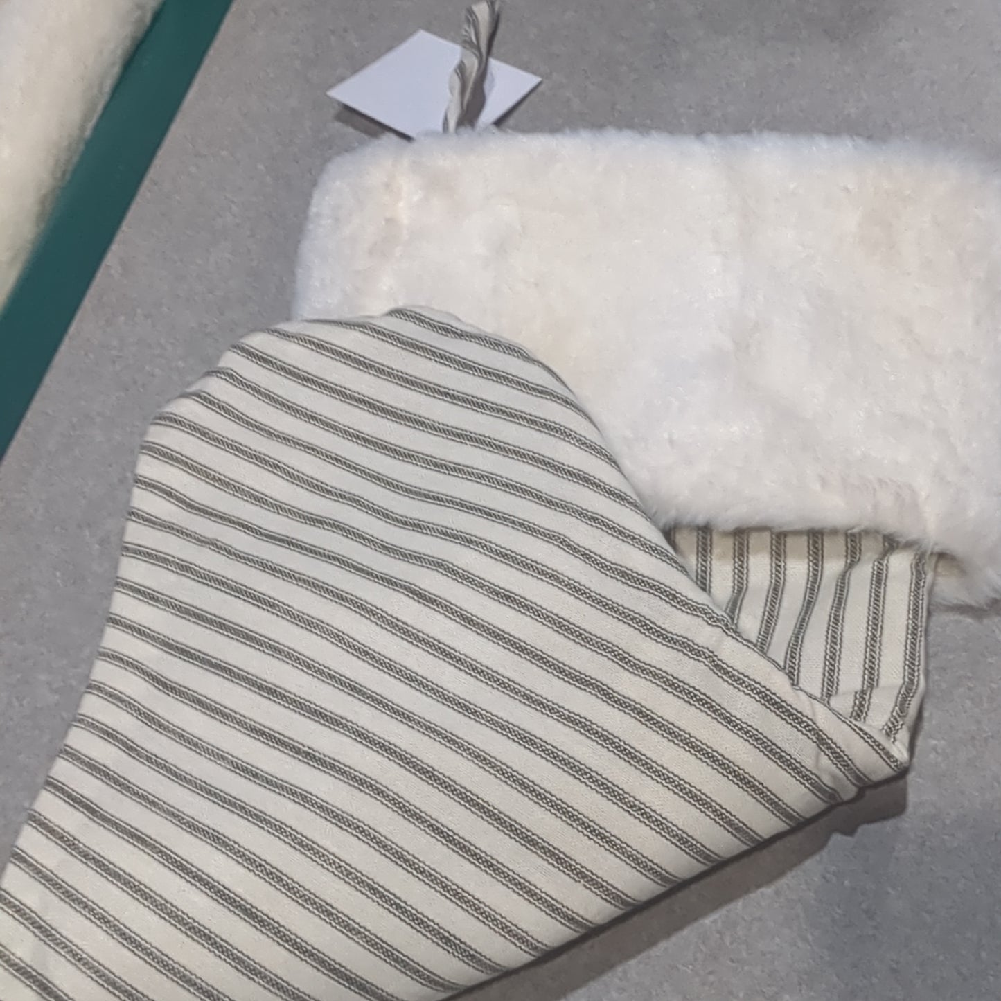 Stocking white with grey stripes. Fuzzy white upper cufft