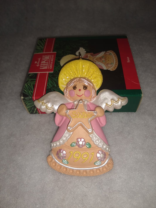 Vintage Hallmark Keepsake ornament Angel Holding gingerbread star Sister written on it 1991 ho92