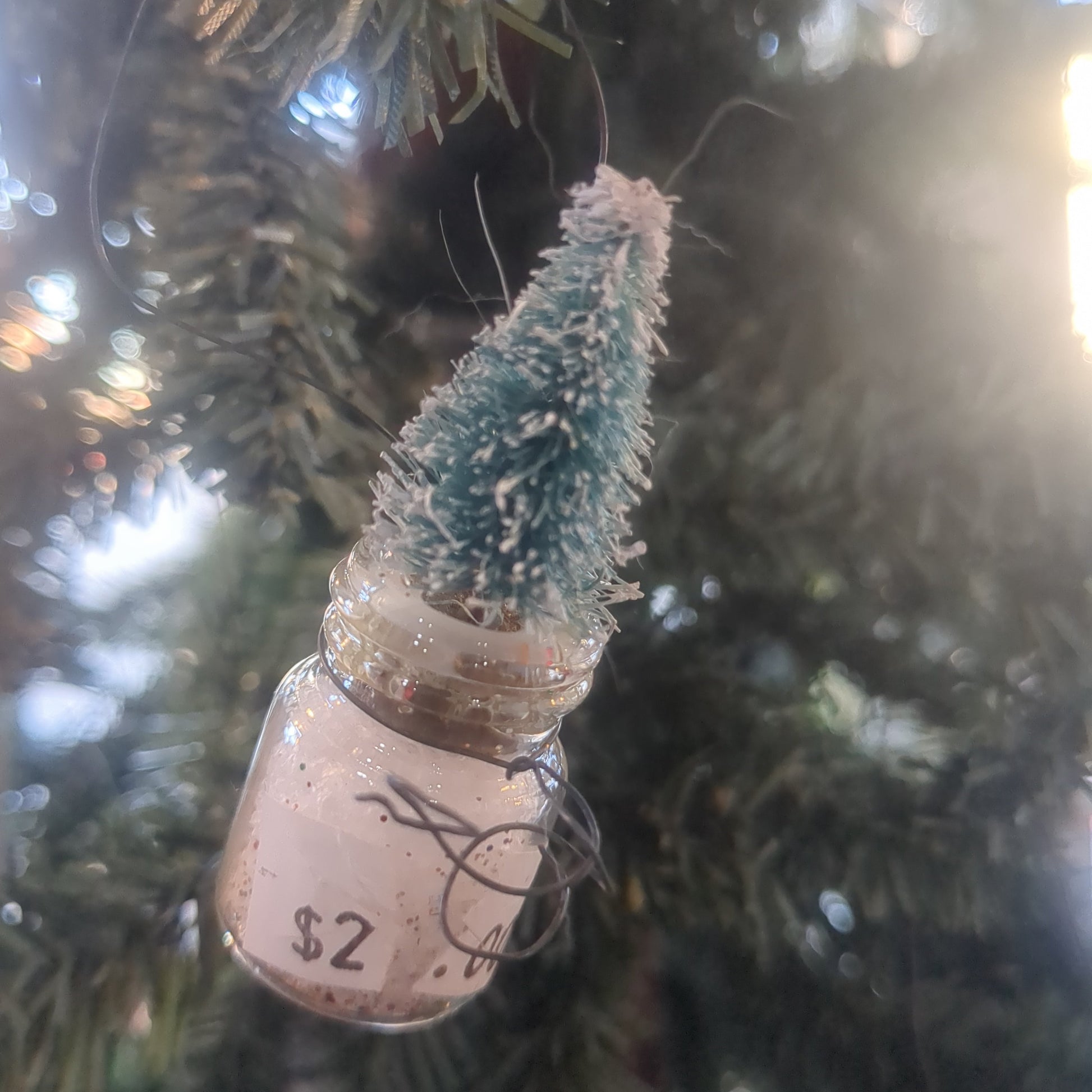 Glass jar With Tree Ornament. Jar is 1 inch tall