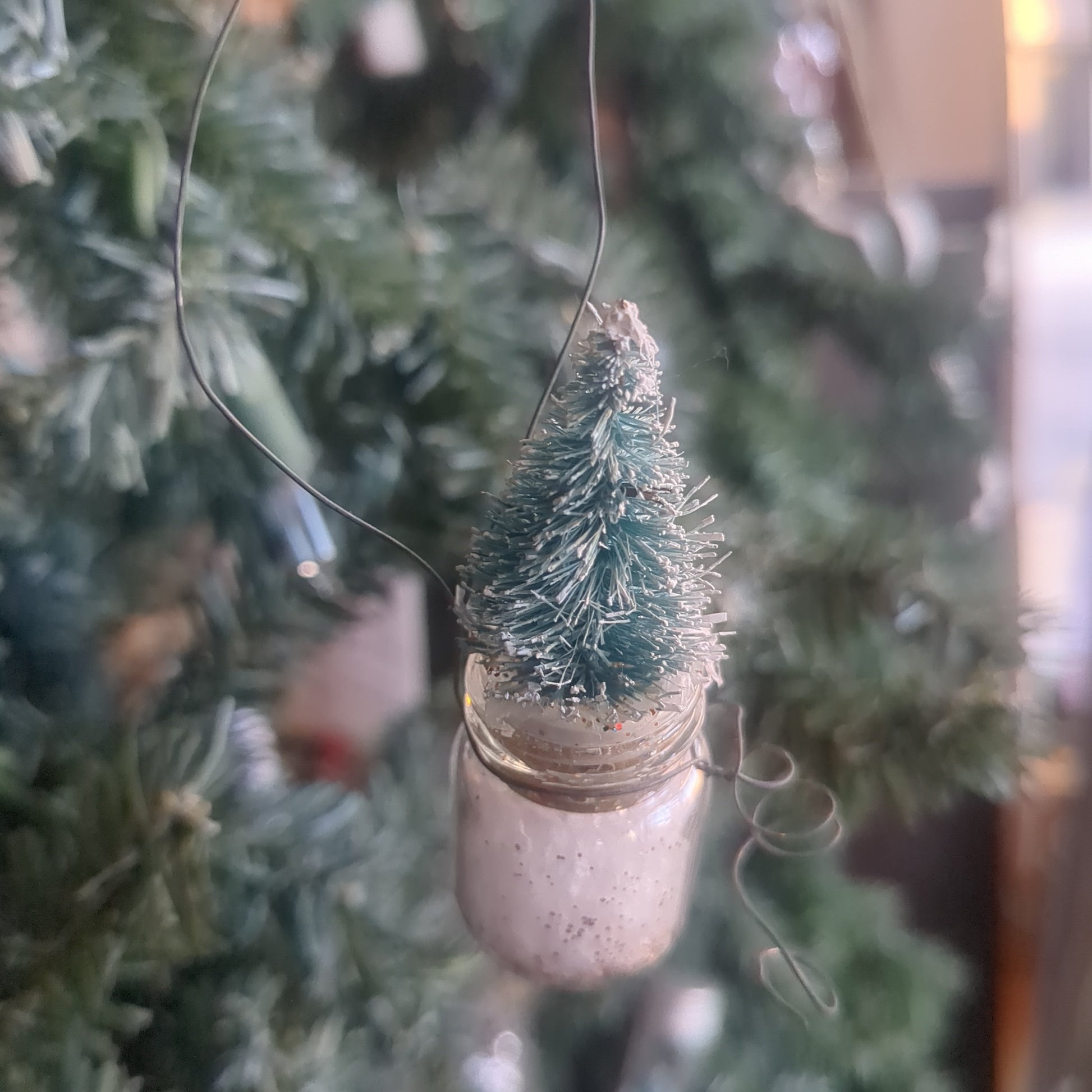 Glass jar With Tree Ornament. Jar is 1 inch tall