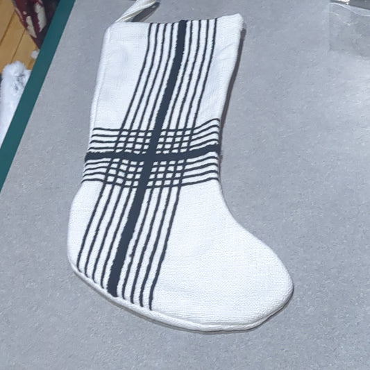 Stocking white with black stripes.