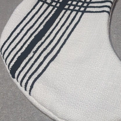 Stocking white with black stripes.