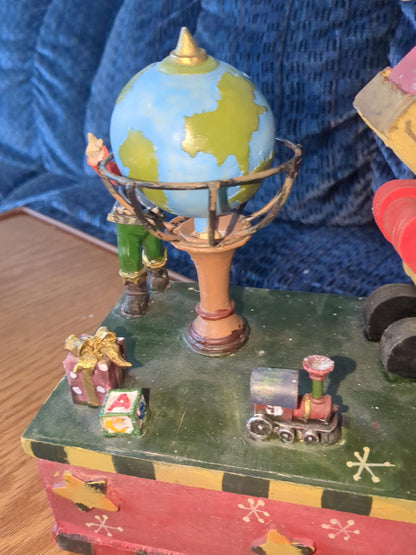 Saint Nicholas Square animated music box with Santa rocking, spinning glove and the elf just watching s49
