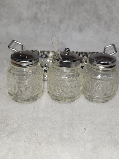 Vintage clear cut glass salt, pepper and condiment set in aluminum holder has tiny spoon sps24
