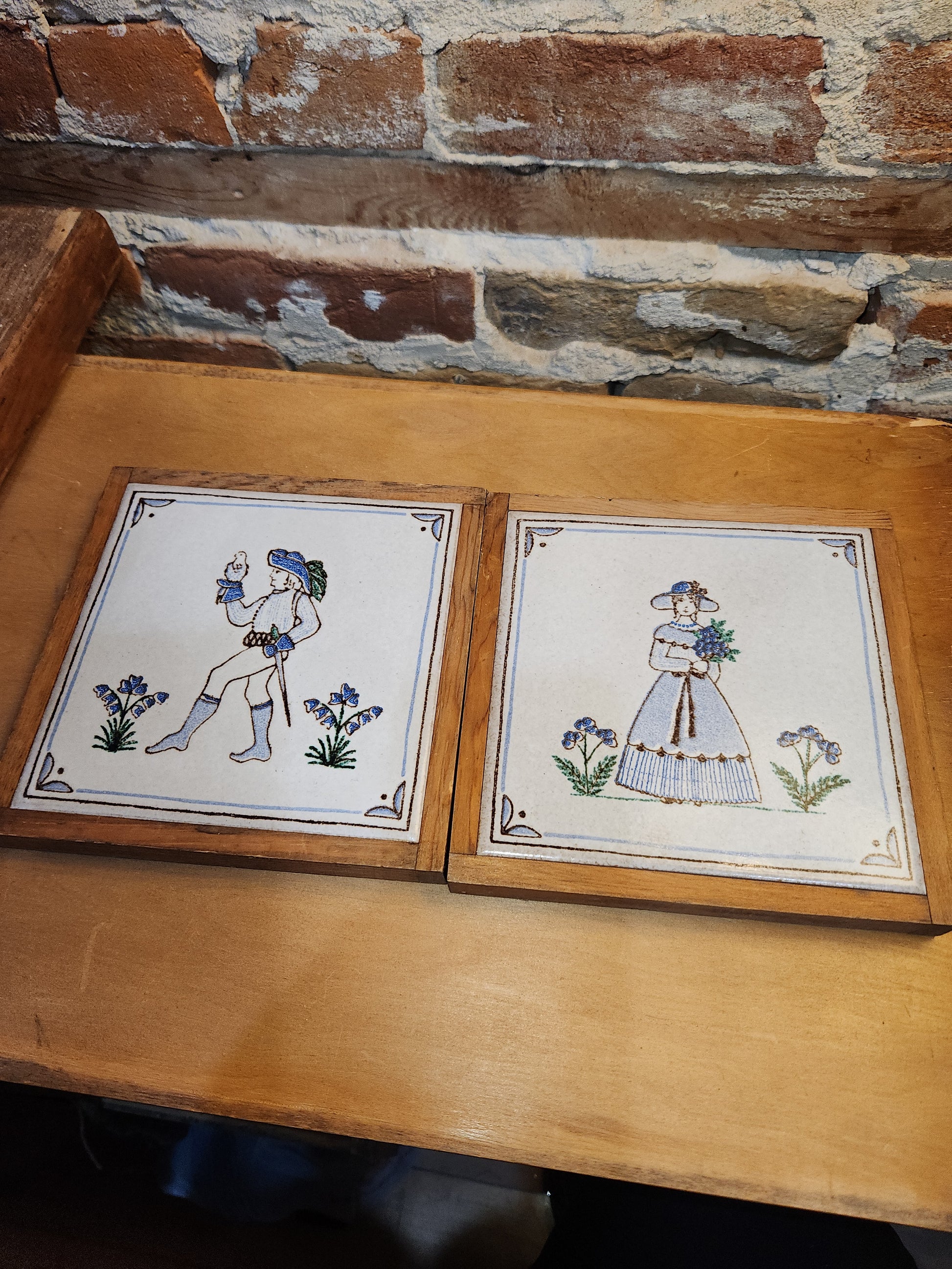 Vintage Pair of Pimme Italian Made Tiles in Frames making Trivets. Drawing is engraved into tile and painted. Man with Falcon and Flower Maiden