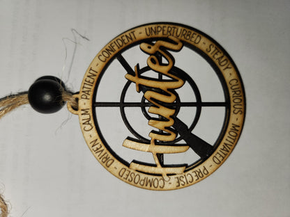 Wooden ornament or car charm.  Hunter