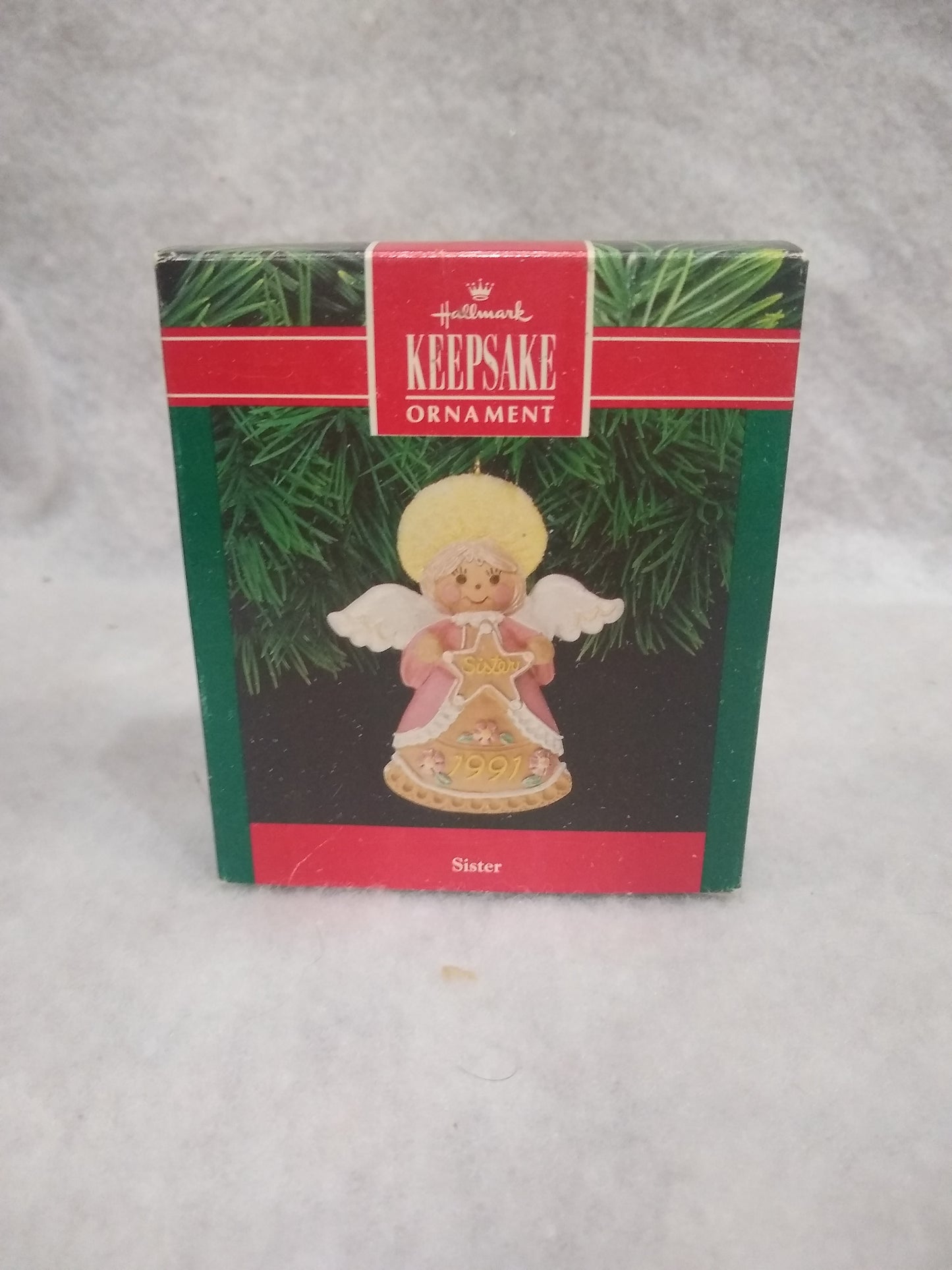 Vintage Hallmark Keepsake ornament Angel Holding gingerbread star Sister written on it 1991 ho92