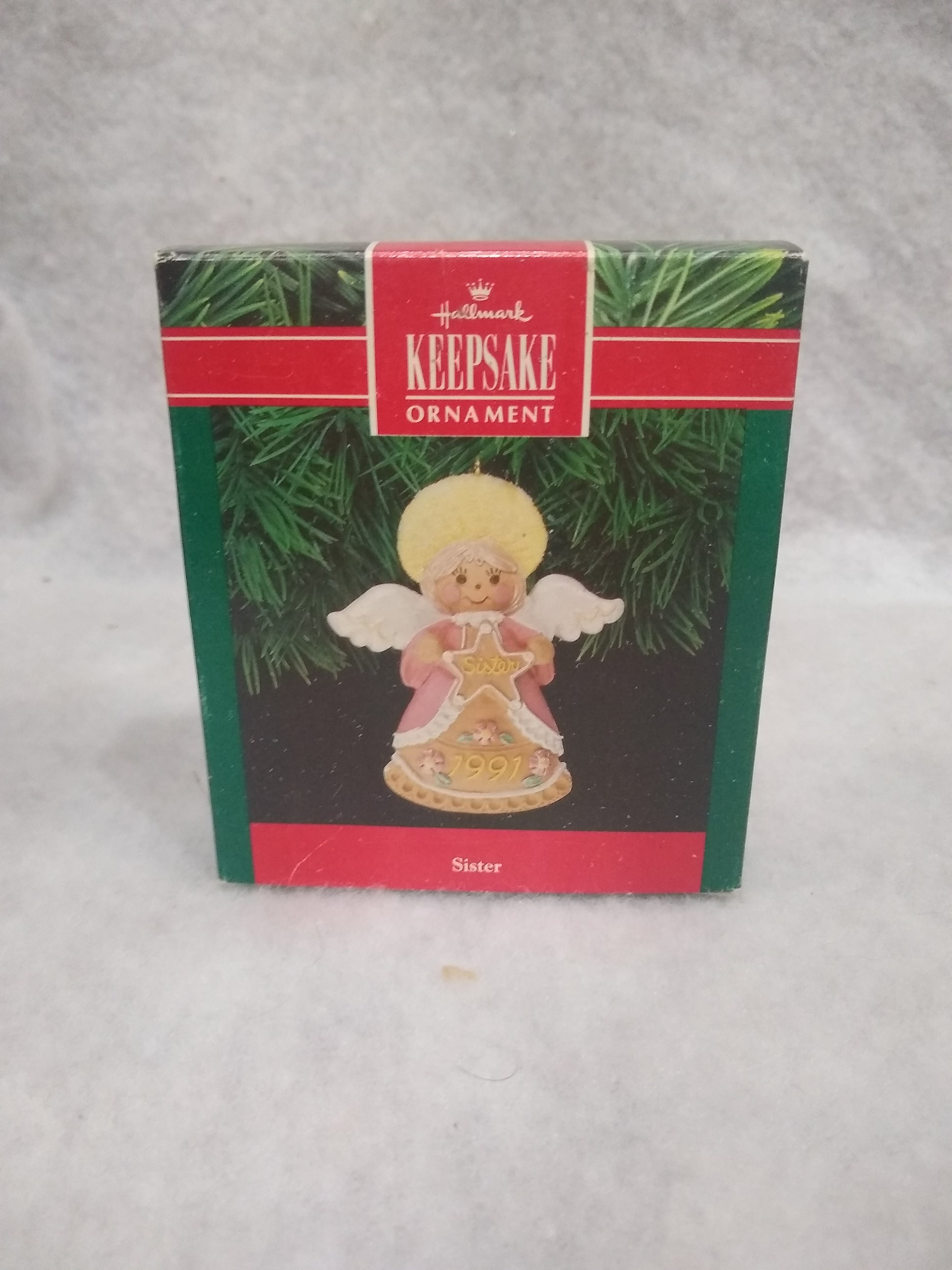 Vintage Hallmark Keepsake ornament Angel Holding gingerbread star Sister written on it 1991 ho92