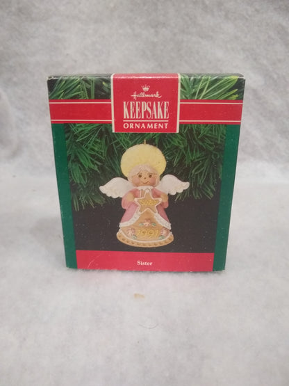 Vintage Hallmark Keepsake ornament Angel Holding gingerbread star Sister written on it 1991 ho92