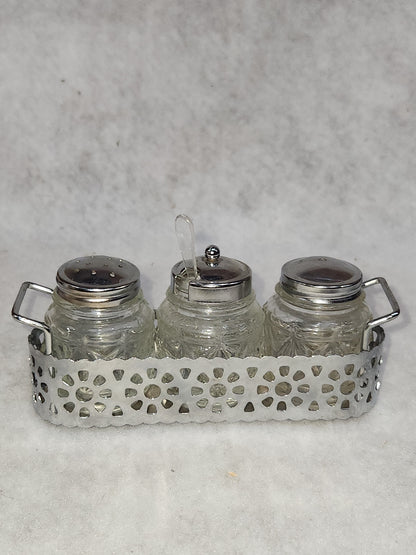 Vintage clear cut glass salt, pepper and condiment set in aluminum holder has tiny spoon sps24