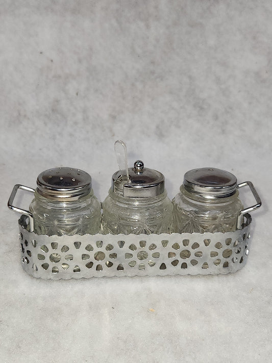 Vintage clear cut glass salt, pepper and condiment set in aluminum holder has tiny spoon sps24