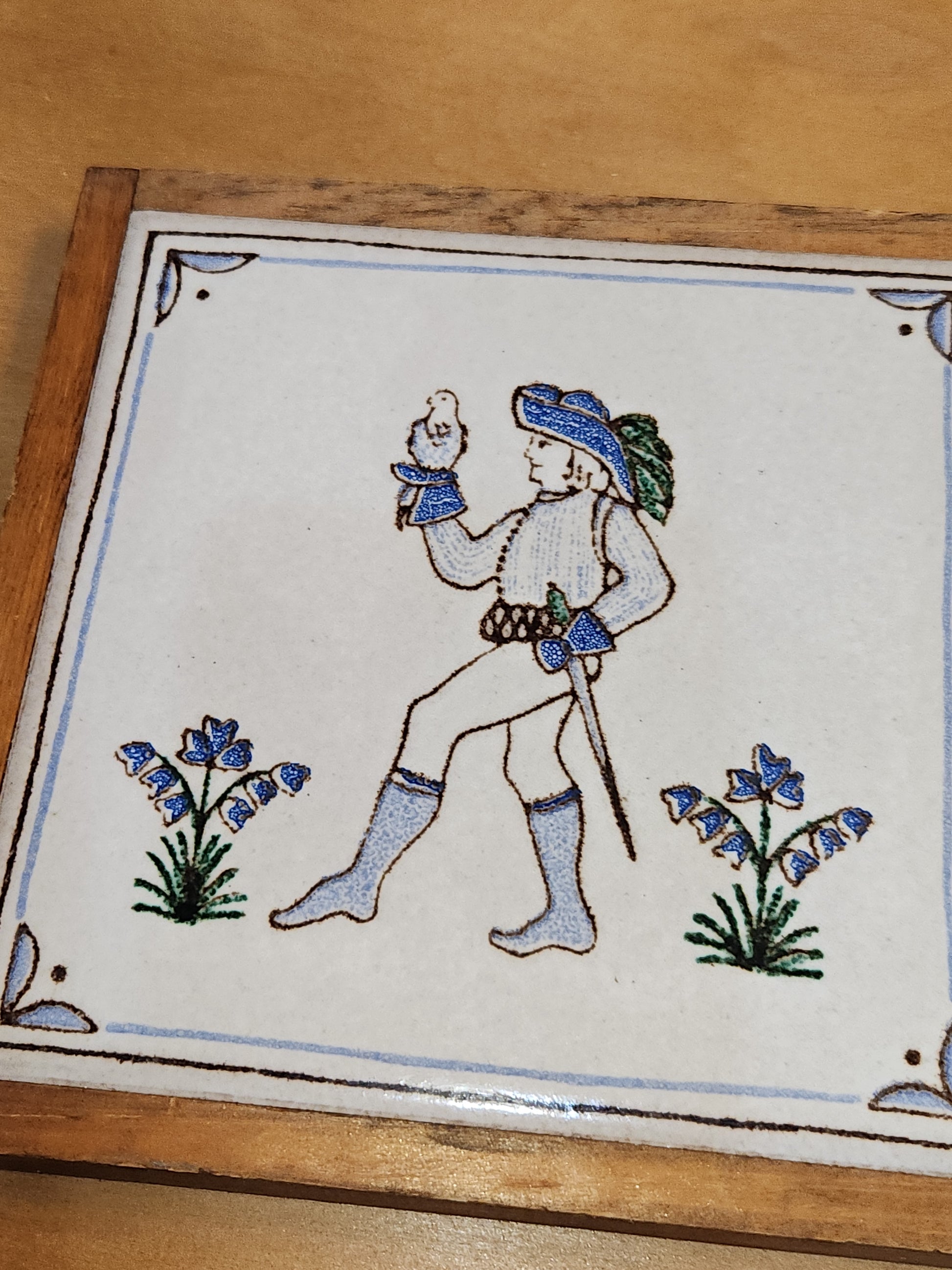 Vintage Pair of Pimme Italian Made Tiles in Frames making Trivets. Drawing is engraved into tile and painted. Man with Falcon and Flower Maiden