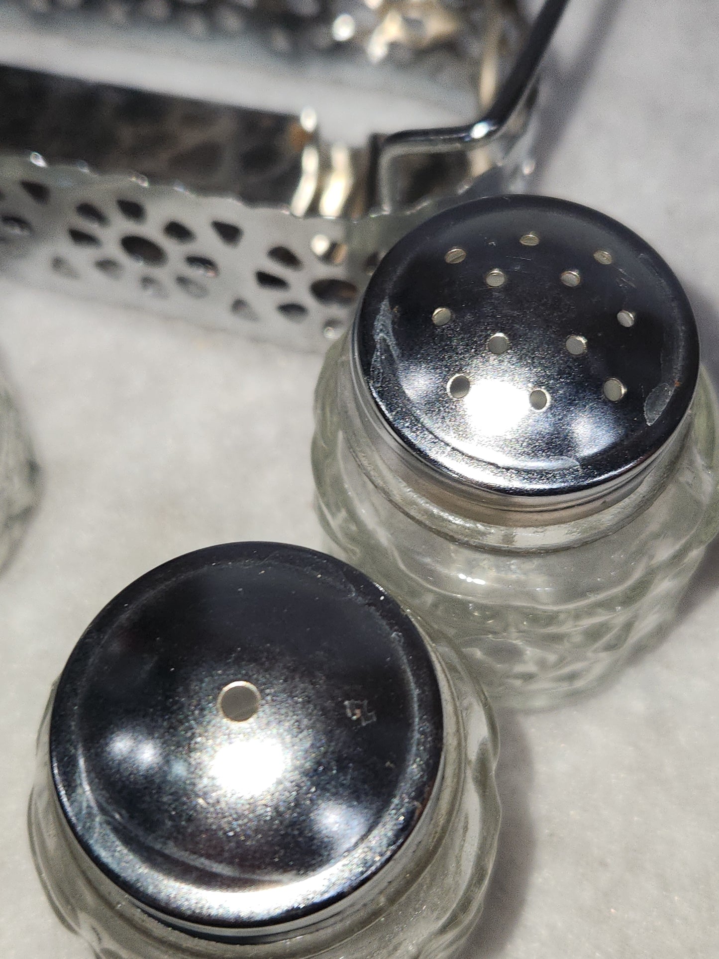 Vintage clear cut glass salt, pepper and condiment set in aluminum holder has tiny spoon sps24