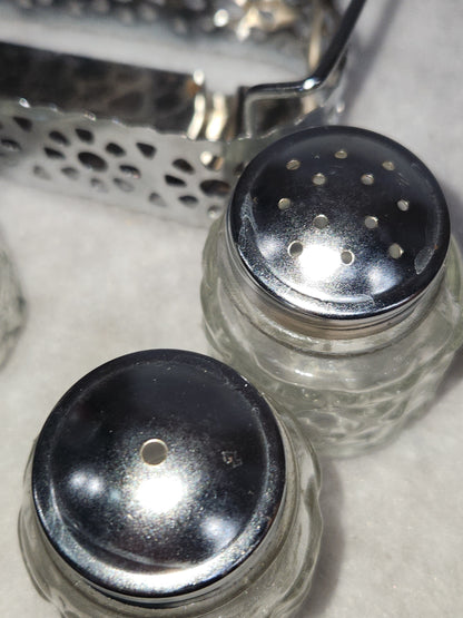 Vintage clear cut glass salt, pepper and condiment set in aluminum holder has tiny spoon sps24