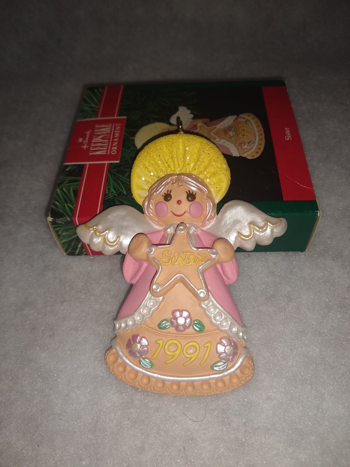 Vintage Hallmark Keepsake ornament Angel Holding gingerbread star Sister written on it 1991 ho92