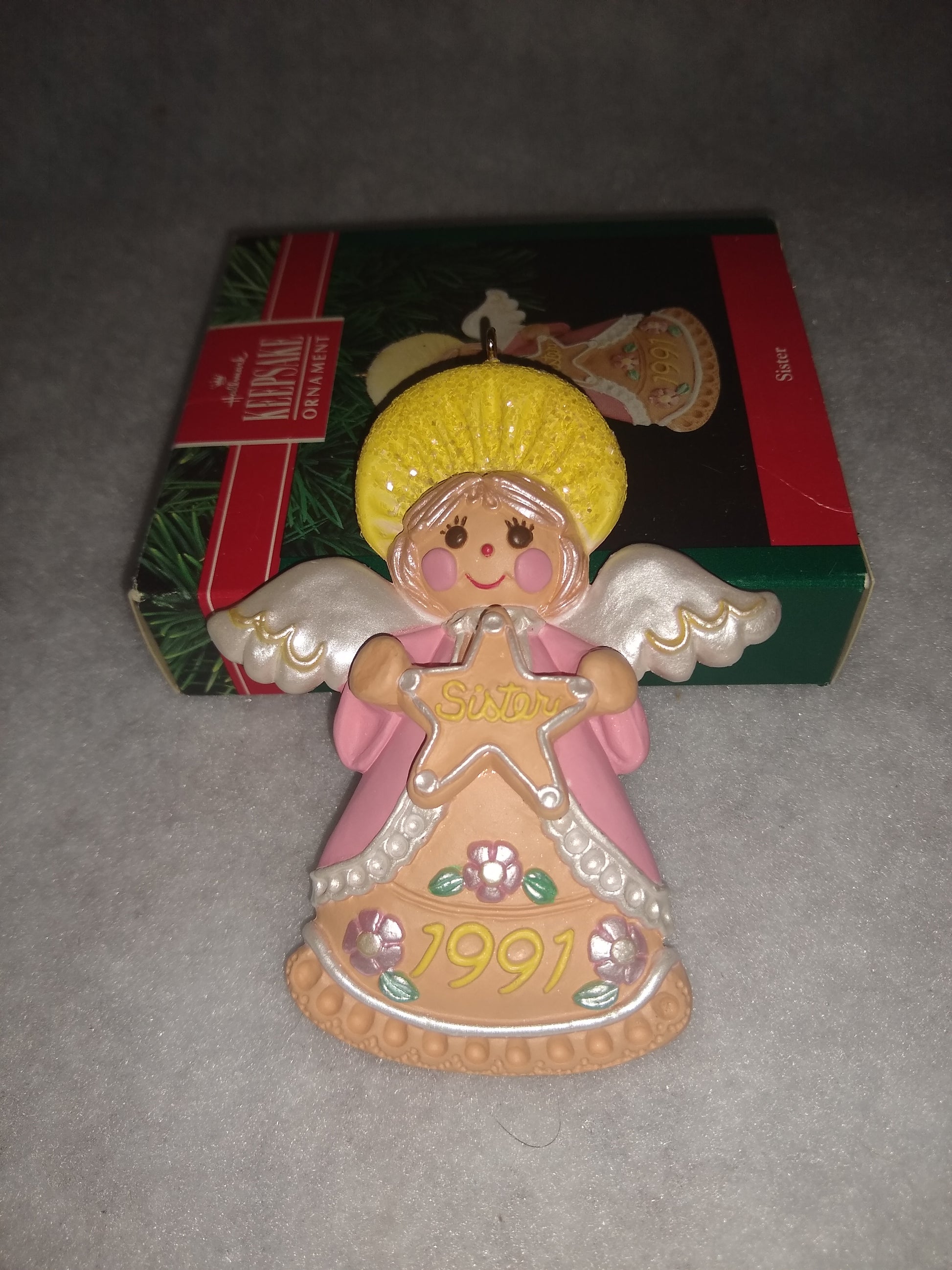 Vintage Hallmark Keepsake ornament Angel Holding gingerbread star Sister written on it 1991 ho92