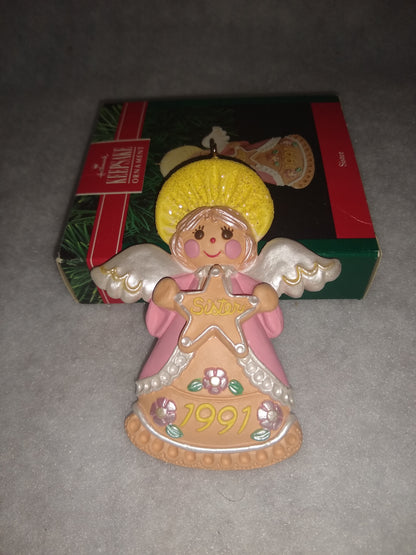 Vintage Hallmark Keepsake ornament Angel Holding gingerbread star Sister written on it 1991 ho92