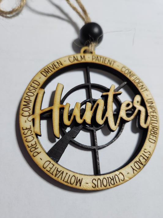 Wooden ornament or car charm.  Hunter