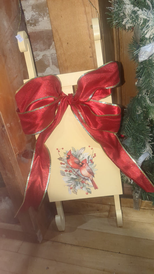 Yellow sled with Cardinals