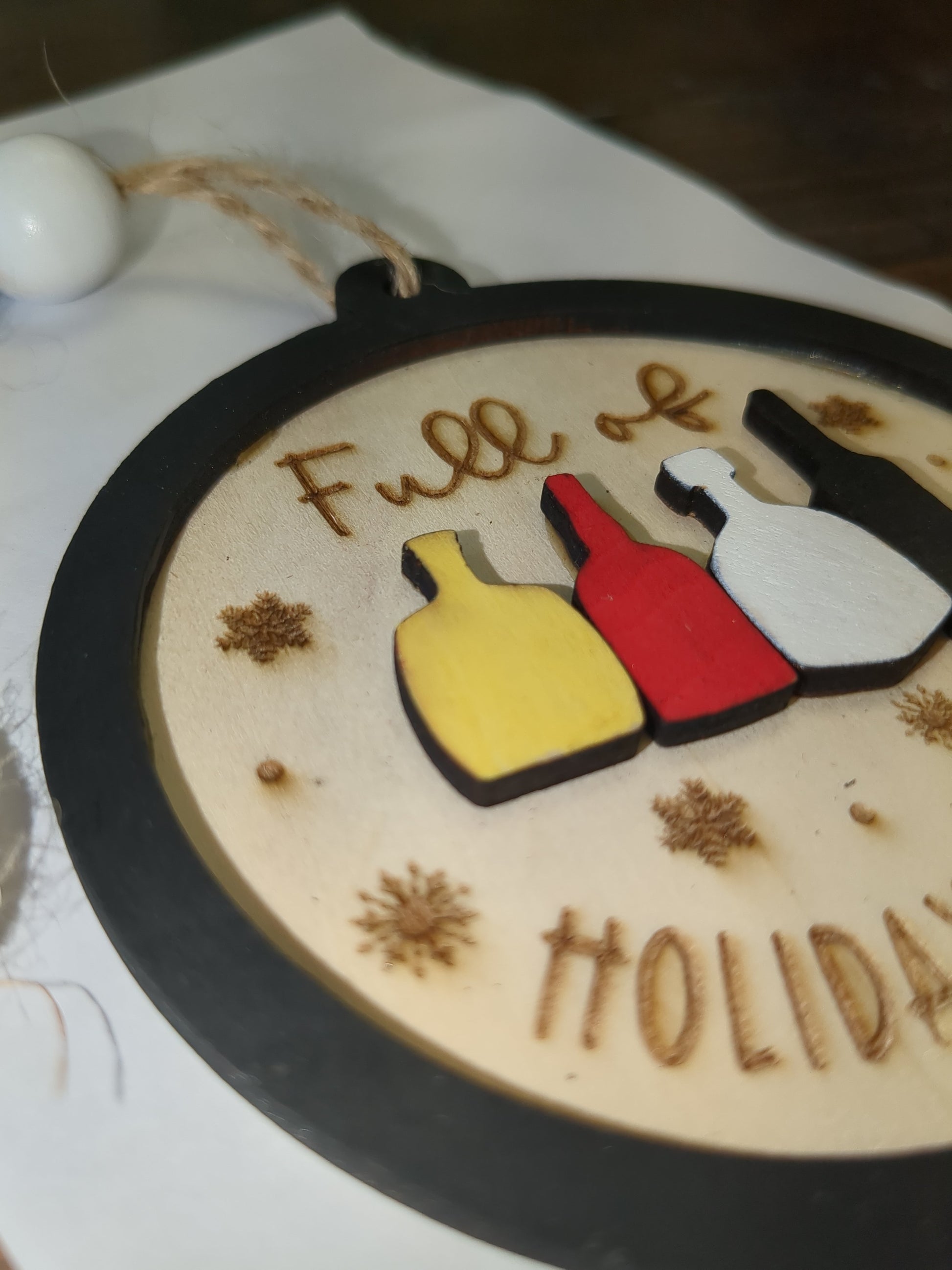 Wooden ornament or car charm. Full of holiday spirits.