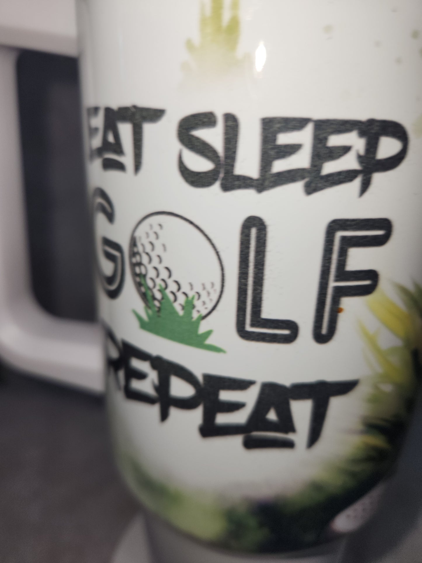 40 Oz Insulated Stainless Steel. Travel Tumbler says, "Eat Sleep Golf Repeat" tgo4