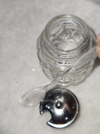 Vintage clear cut glass salt, pepper and condiment set in aluminum holder has tiny spoon sps24