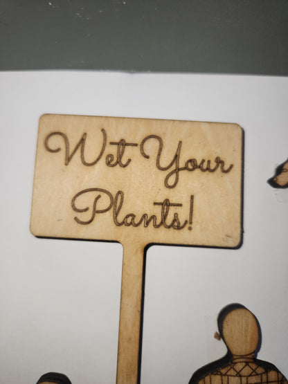 Wet Your Plants potting plant stakes dog, man, woman boy