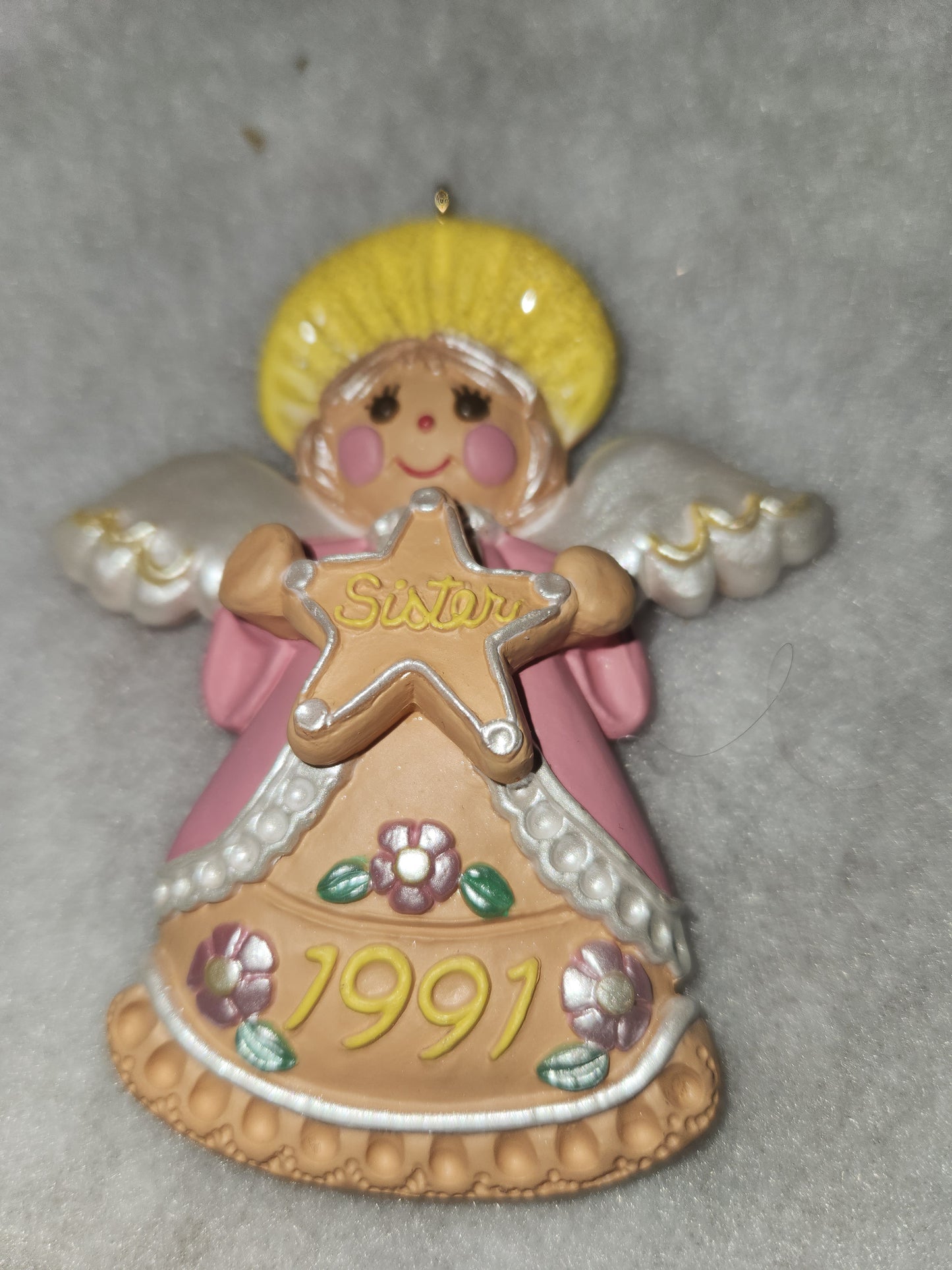 Vintage Hallmark Keepsake ornament Angel Holding gingerbread star Sister written on it 1991 ho92